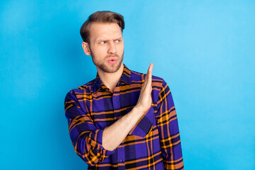 Sticker - Portrait of attractive suspicious man showing aside palm no disagree decline isolated over bright blue color background