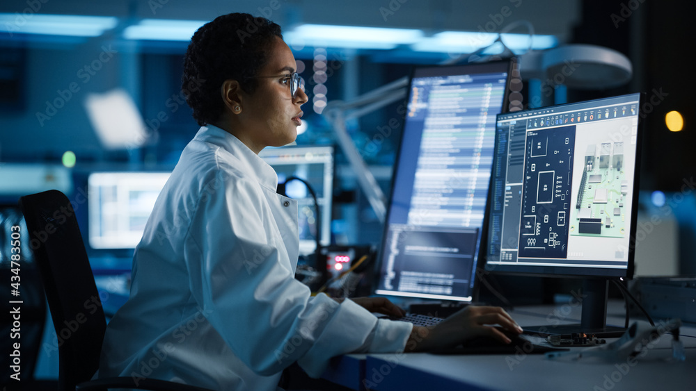 Modern Electronics Facility: Scientist, Engineer Works on Computer with ...