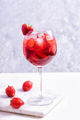 Wine glass of strawberry alcohol aperol or daiquiri cocktail.