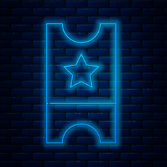 Sticker - Glowing neon line Baseball ticket icon isolated on brick wall background. Vector