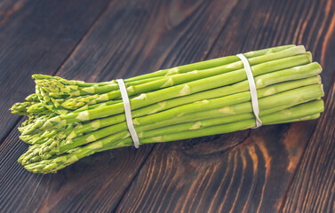 Wall Mural - Fresh asparagus on the wooden background