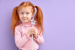 © alfa27 - smiling little girl child holding magic wand in hand, want to be enchantress, adorable cute kid girl with natural red hair dreams looking away, game of fairy. Costume party