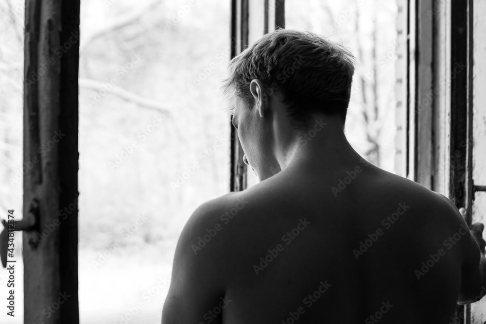 Naked young handsome model men with muscular body and torso standing