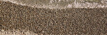Pebble Beach Background Top View. Isolated Background Of Sea Beach With Diagonal Line Separating Claim Ocean Sea Lake Water. Shingle Beach Ar Or Claim Water Texture. Nature Wallpaper.