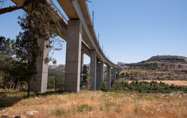 A railway bridge for fast trains connecting Jerusalem with Tel-Aviv. 
A bridge crossing over a valley Emek HaArazim. Jerusalem on the background.