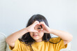 © MIA Studio - Healthy eyes and vision.Portrait happy asian kid child holding heart shaped hands on eyes.Smiling Girl With Healthy Skin Showing Love Sign. Eye care.Carotene vitamin.Focus, optician doctor, optical.
