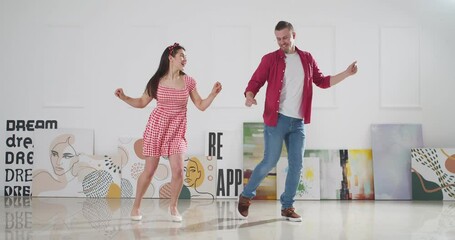 Canvas Print - Happy young couple dancing at home