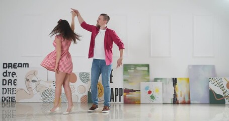 Poster - Happy young couple dancing at home