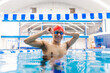 © Marcos - Paralympic disabled Swimmer  latin man Training In Pool with hand hypoplasia in disability concept