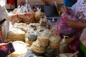 Stall selling tortillas and corn products. Sale of tortillas in the Mexican market.