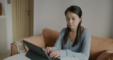 Wall Mural - Woman work on tablet computer at home