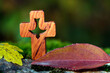 Wooden christian coss with Holy Spirit with autumn leaf.  France.