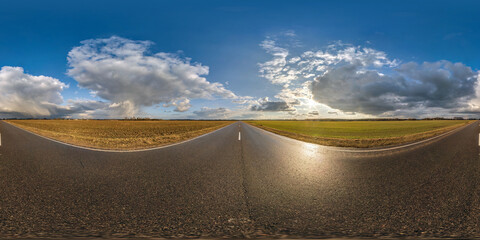 Wall Mural - full seamless spherical hdri panorama 360 degrees angle view on asphalt road among fields in summer evening sunset with awesome clouds in equirectangular projection, ready for VR AR virtual reality