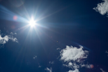 Wall Mural - blue sky with sun and clouds