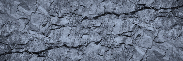Wall Mural - gray rock texture with cracks. stone wall background with copy space for text and design. wide banne