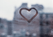 Love Concept, Heart Silhouette On A Window Glass