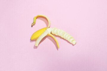 Banana on a pink background. Minimal concept. Flat lay.