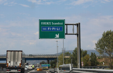 Italian road signs motorway with directions to reach the cities of Florence and Scandicci and the large road called FILIPI that connects the cities of Firenze Pisa and Livorno in Central Italy