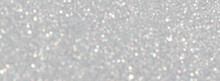 White And Grey Glitter Bokeh Circle Glow Blurred And Blur Abstract. Glittering Shimmer Bright Luxury. White And Silver Glisten Twinkle For Texture Wallpaper And Background Backdrop.
