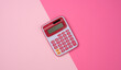© nndanko - pink plastic calculator on pink background