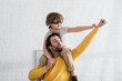 © LIGHTFIELD STUDIOS - Father and son in aviator goggles showing yes gesture