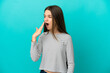 © luismolinero - Little girl over isolated blue background yawning and covering wide open mouth with hand