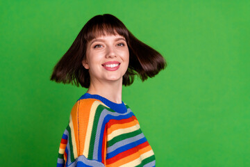 Canvas Print - Photo of funky happy young charming woman fly hair smile good mood isolated on green color background