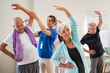 © Rido - Senior people stretching with trainer at retirement community