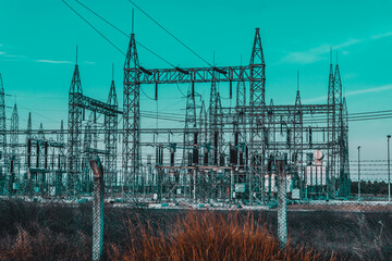 high voltage electrical substation with steel frames, insulators and electricity transmission power 