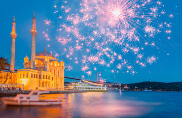 Wall Mural - Ortakoy mosque and Bosphorus bridge with  pink fireworks at twilight blue hours - Istanbul, Turkey