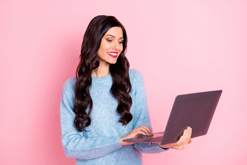 Sticker - Portrait of pretty positive person look netbook beaming smile wear pullover isolated on pink color background