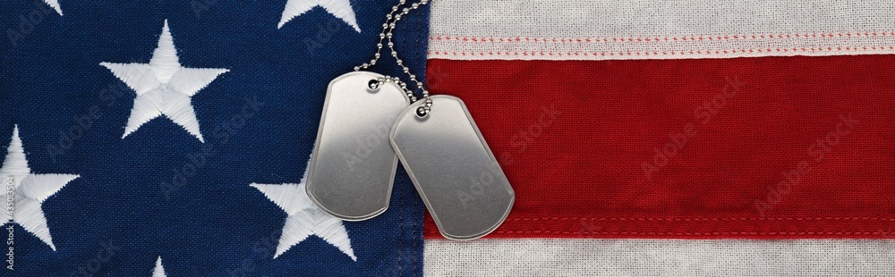 US military soldier's dog tags, rough and worn with blank space for ...