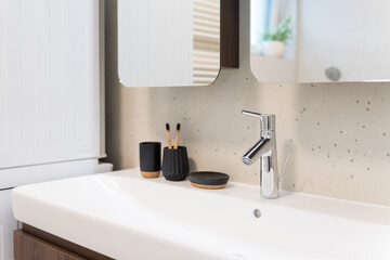 Detail of sink in contemporary bathroom