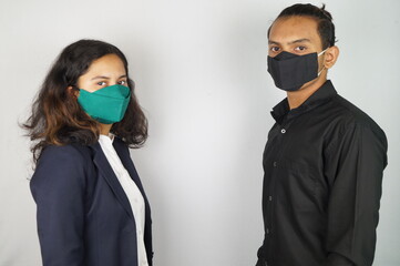 Girl Wearing Mask In Office , corona warriors , young man wearing mask , corona warriors , using sanitizer image . Vastav Kharat .