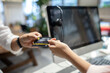 © nikomsolftwaer - Customer paying with contactless credit card. Woman at the supermarket checkout, she is paying using a credit card, shopping and retail concept