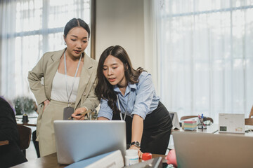 Women asian working together, at office . Businesswomen Having Informal Meeting In Modern Office