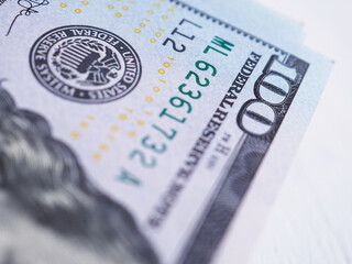 Close up, American one hundred dollar banknote on white background. Selective focus.