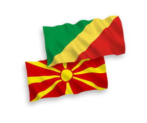 National vector fabric wave flags of Republic of the Congo and North Macedonia isolated on white background. 1 to 2 proportion.