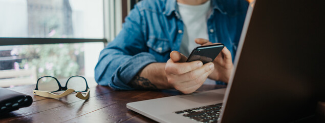 Man pointing on smartphone screen, chatting in social networks, meeting website, searching internet, sending sms, using text messenger or online banking.