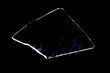 piece of broken glass insulated on a black background