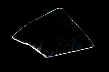 Wall Mural - piece of broken glass insulated on a black background