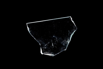 Wall Mural - glass fragment isolated on a black background. broken window