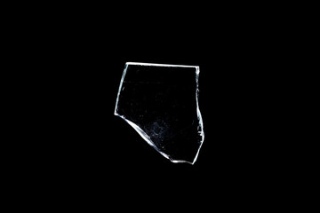Wall Mural - glass fragments in isolation on a black background. damaged window. damaged object