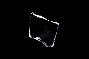 Wall Mural - glass fragments in isolation on a black background. damaged window. damaged object