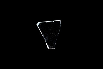 Wall Mural - glass fragments in isolation on a black background. damaged window. damaged object
