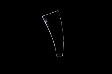 Wall Mural - glass fragments in isolation on a black background. damaged window. damaged object