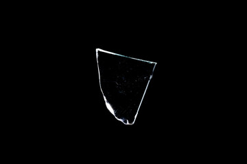 Wall Mural - glass fragments in isolation on a black background. damaged window. damaged object