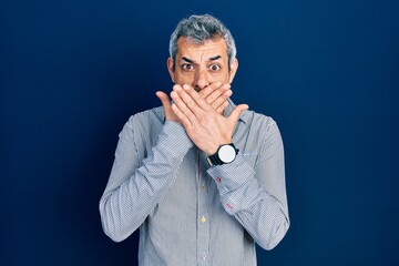 Sticker - Handsome middle age man with grey hair wearing business shirt shocked covering mouth with hands for mistake. secret concept.