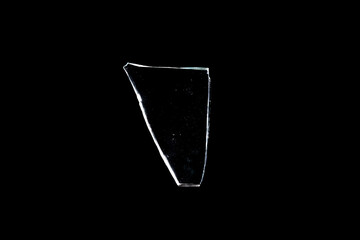 Wall Mural - glass fragments in isolation on a black background. damaged window. damaged object