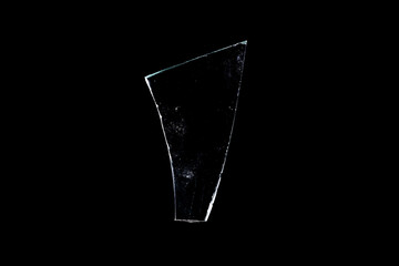 Wall Mural - glass fragments in isolation on a black background. damaged window. damaged object